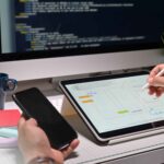 ui ux designer with tablet doing app mobile project