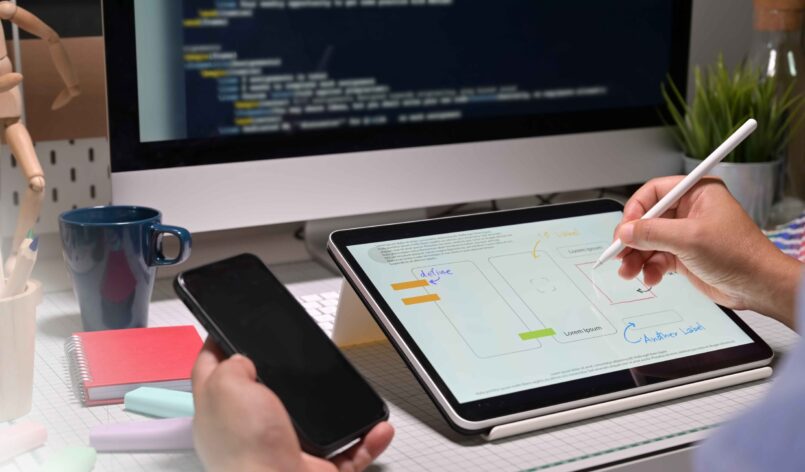 ui ux designer with tablet doing app mobile project
